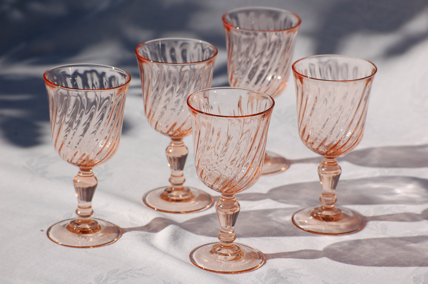 Set of 5 French vintage rosaline swirl wine glasses from the seventies. Set of 5 French vintage rosaline swirl wine glasses from the seventies. Have your rose in seventies mood with these colorfull and elegant glasses in a light rose color. French rosaline swirl wine glasses. Set of 5 glasses from Arcoroc Luminarc, France. ©MediterraStyle