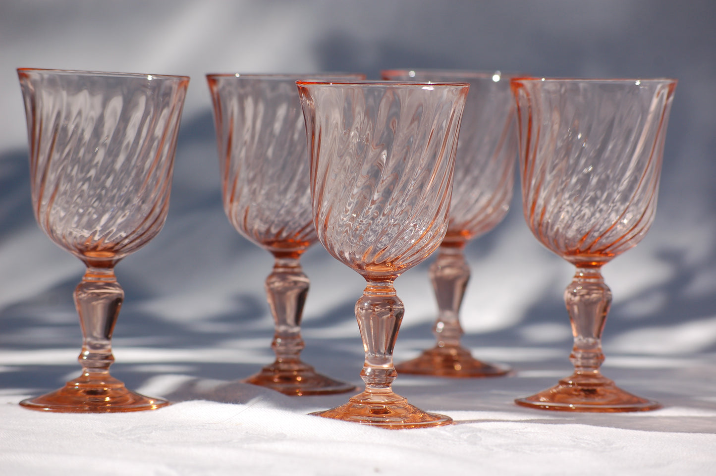 Set of 5 French vintage rosaline swirl wine glasses from the seventies. Set of 5 French vintage rosaline swirl wine glasses from the seventies. Have your rose in seventies mood with these colorfull and elegant glasses in a light rose color. French rosaline swirl wine glasses. Set of 5 glasses from Arcoroc Luminarc, France. ©MediterraStyle