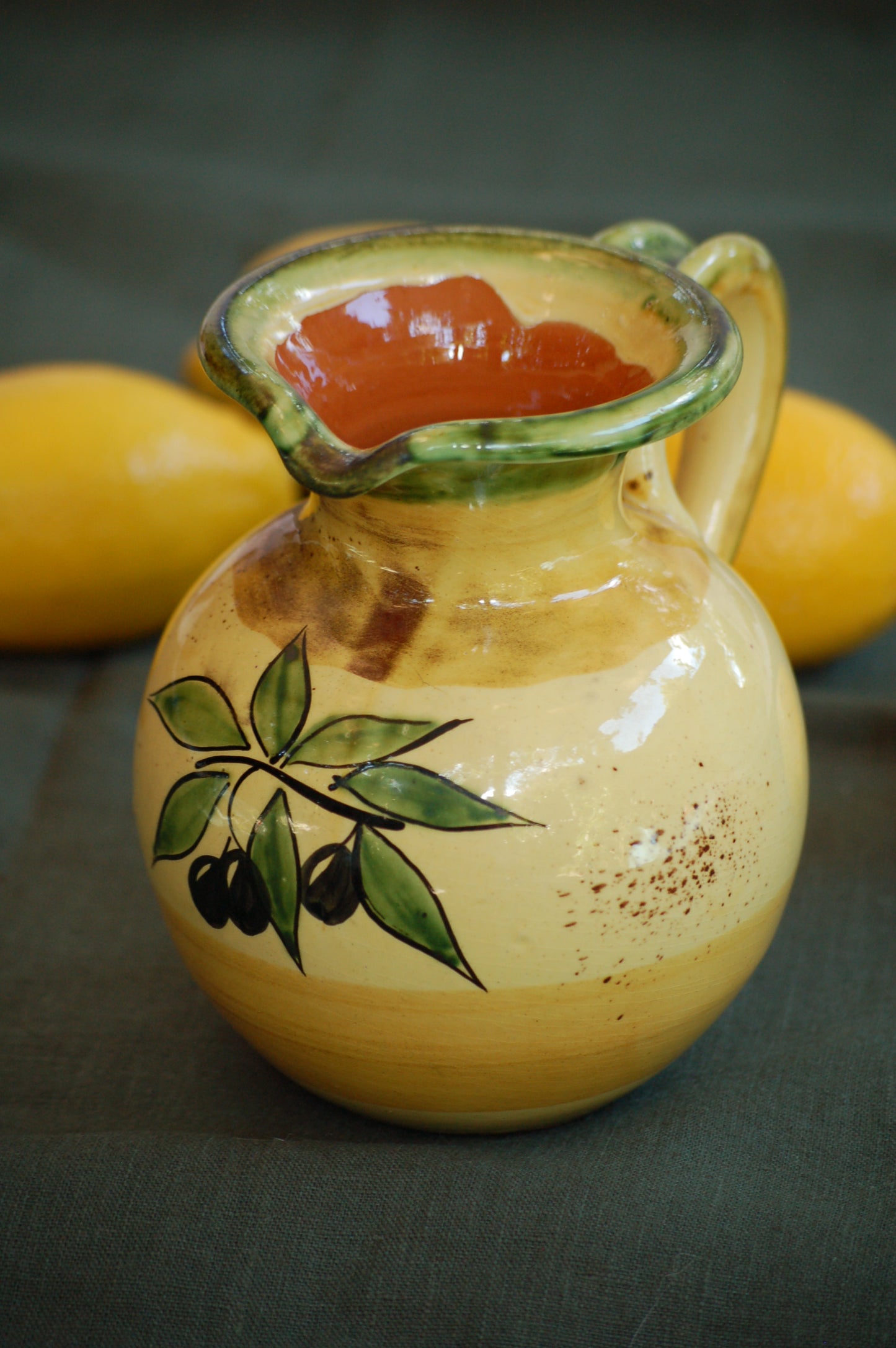 ©mediterraStyle A beautiful Provencal ceramic carafe with hand-painted decoration representing an olive branch with its fruits. This vintage item is as new and comes from the 1970's. Signed on the bottom: "Bd'A France' A beautifil warm colored addition to your kitchen. Loved and sold by MediterraStyle
